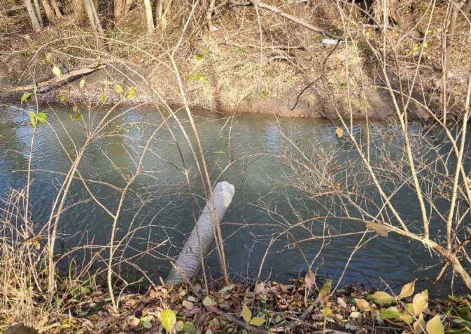 A pipe entering Tontogany Creek near NW corner of the Site. May drain neighbors’ property or part of the Site.