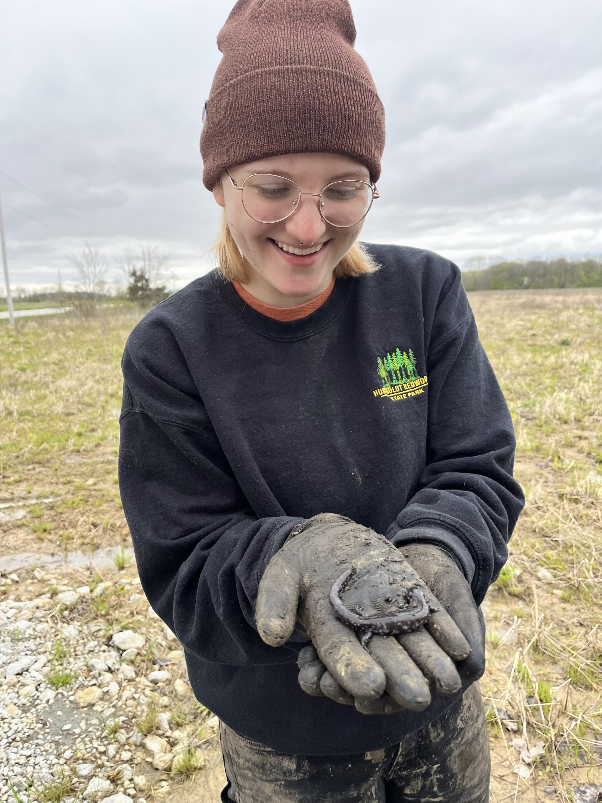 Meredith Holler holding a salamander